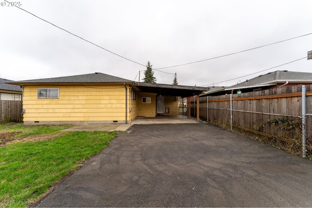 view of front of house with a carport