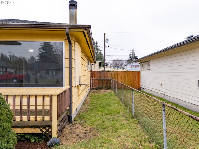 view of side of home featuring a yard