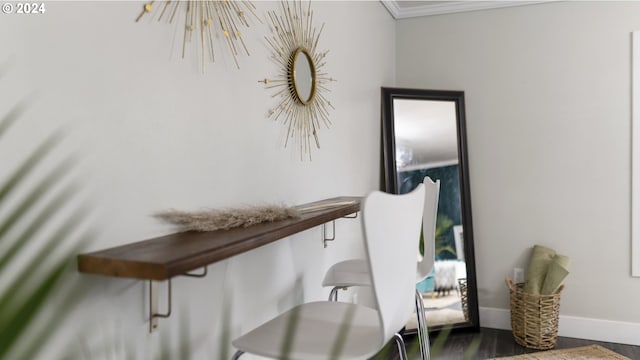 home office with baseboards and wood finished floors