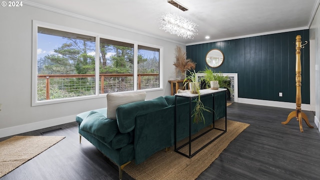 living area with ornamental molding, a wealth of natural light, visible vents, and dark wood-style floors