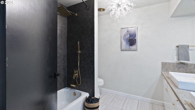 bathroom featuring tub / shower combination, toilet, vanity, and baseboards