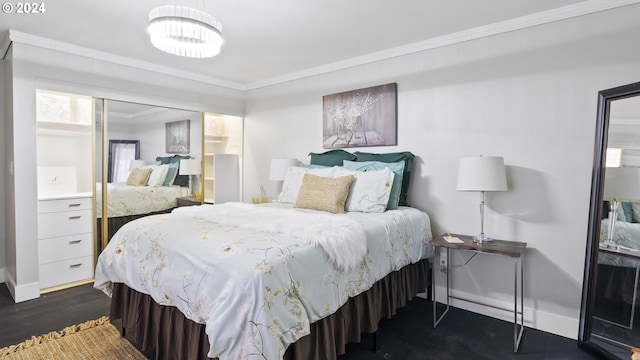 bedroom with ornamental molding, dark wood-style flooring, and baseboards