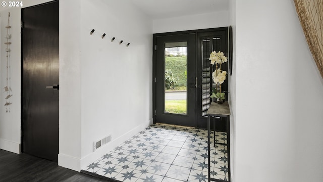 entrance foyer with visible vents and baseboards