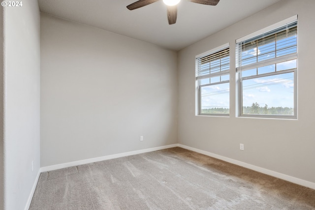 unfurnished room with light carpet and ceiling fan