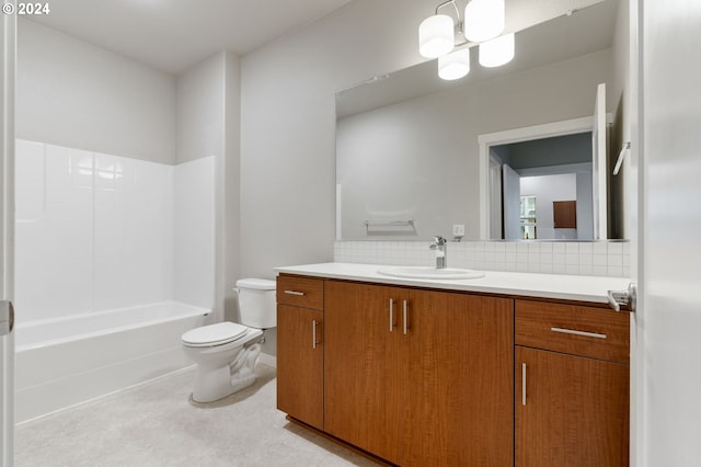 full bathroom featuring decorative backsplash, shower / bathing tub combination, vanity, and toilet