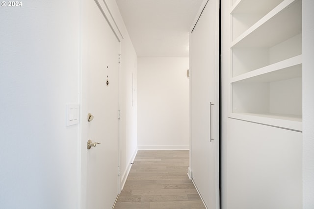 corridor featuring light hardwood / wood-style flooring