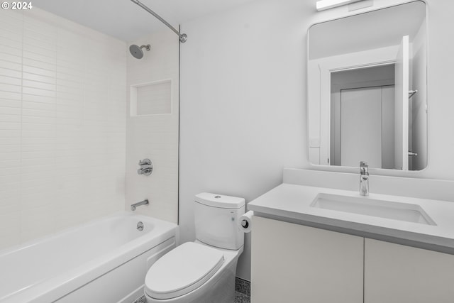 full bathroom featuring vanity, toilet, and tiled shower / bath