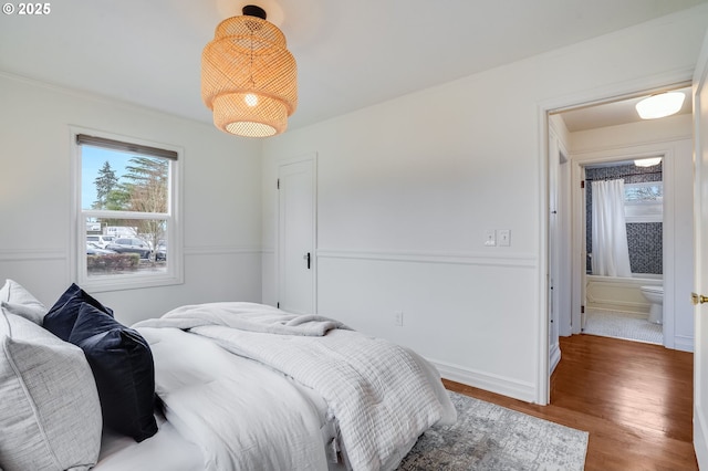 bedroom with hardwood / wood-style flooring