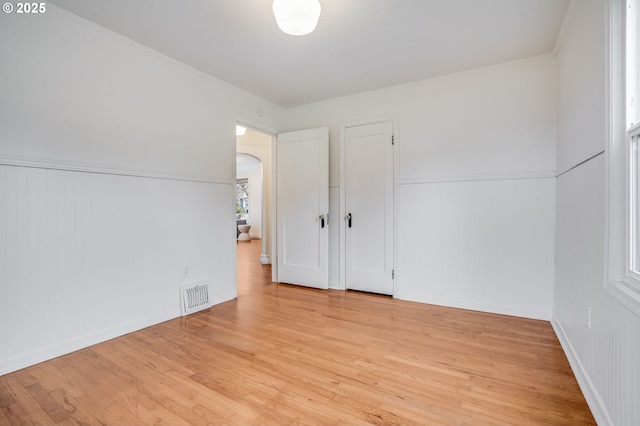 unfurnished room featuring light hardwood / wood-style flooring