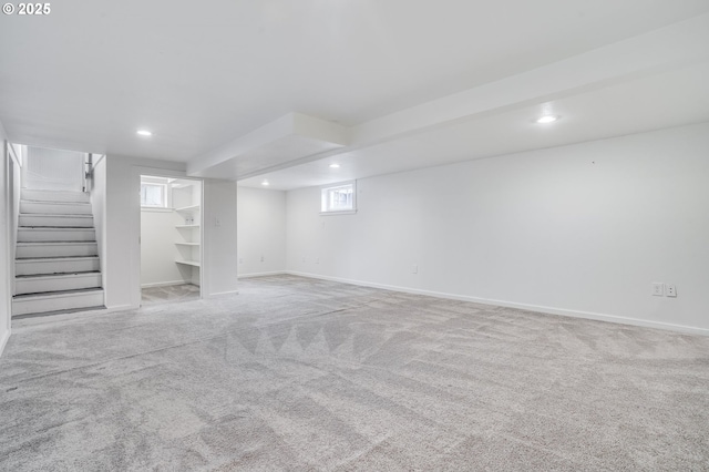 basement with light colored carpet