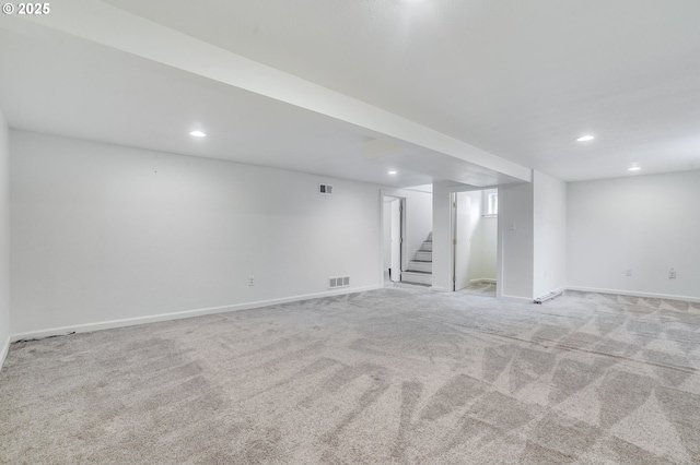 basement with light colored carpet