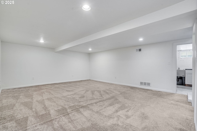 interior space featuring light carpet