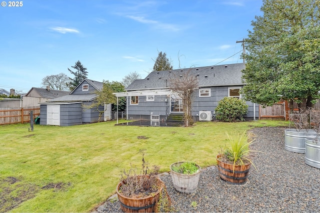 rear view of house featuring ac unit, a lawn, and a storage unit