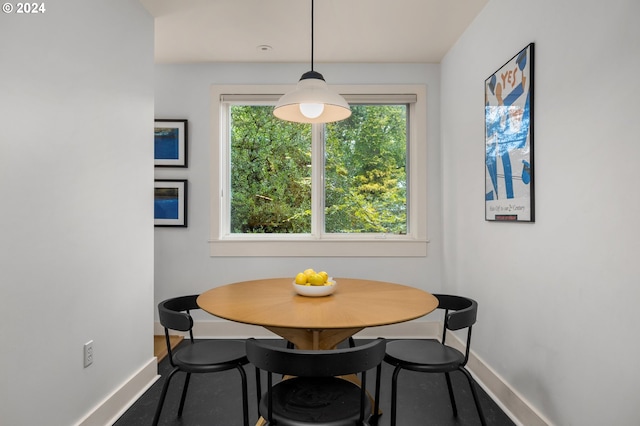 dining space with baseboards and breakfast area