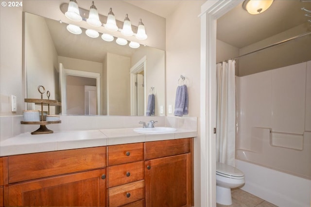 full bathroom featuring shower / tub combo with curtain, dual bowl vanity, toilet, and tile patterned flooring