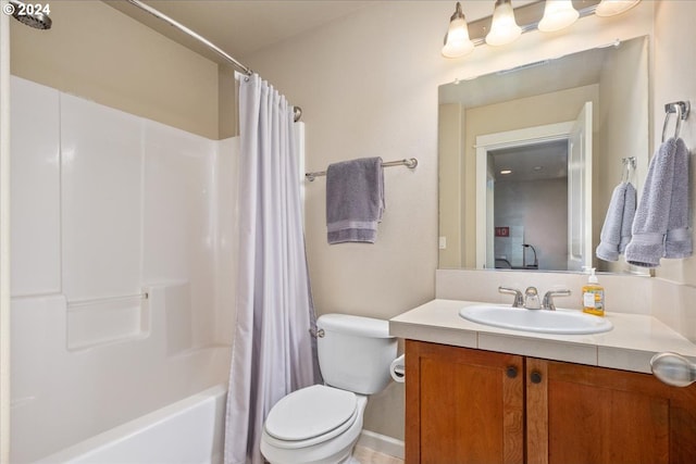 full bathroom featuring toilet, shower / tub combo with curtain, and vanity