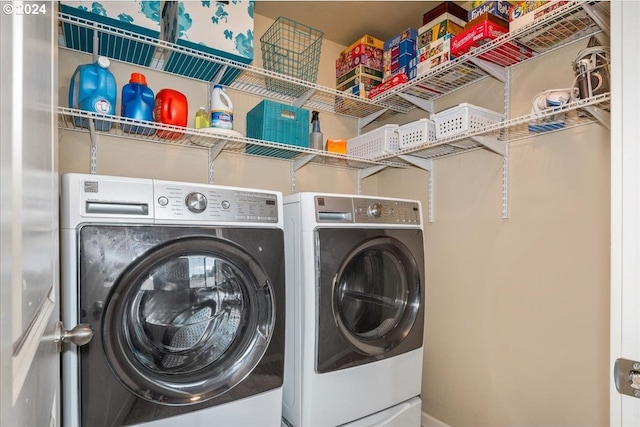 washroom featuring washing machine and dryer