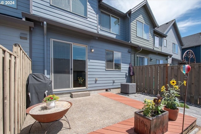 wooden terrace featuring central AC unit