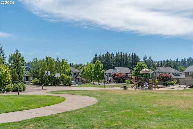 surrounding community with a playground and a yard