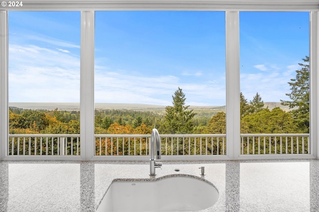 unfurnished sunroom featuring sink