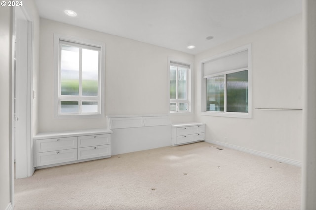 unfurnished bedroom with light carpet