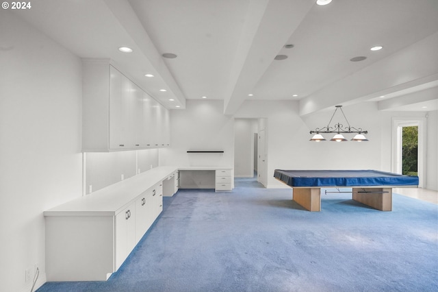 recreation room featuring pool table, light carpet, and built in desk