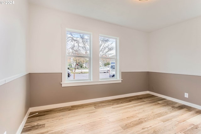 empty room with light hardwood / wood-style floors