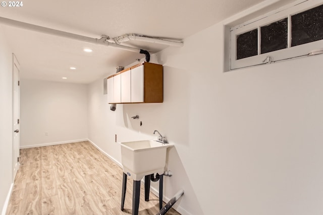 laundry room featuring light hardwood / wood-style floors