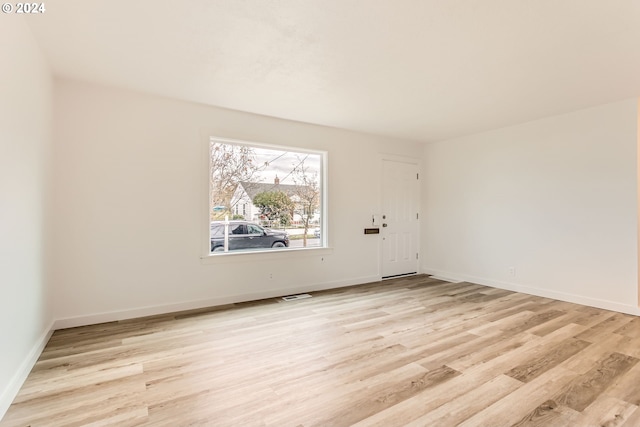 spare room with light hardwood / wood-style floors