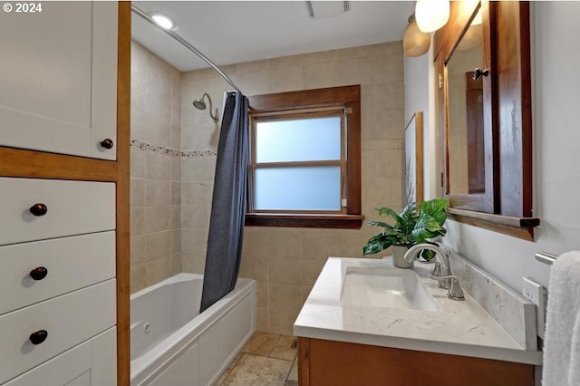 bathroom with vanity, tile walls, tile patterned flooring, and shower / bathtub combination with curtain