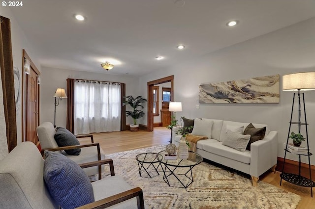 living room with light hardwood / wood-style flooring