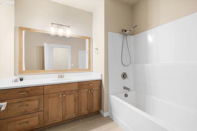 bathroom with tile patterned flooring, vanity, and bathtub / shower combination