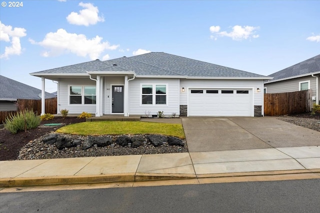 ranch-style house with a front lawn and a garage