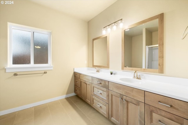 bathroom featuring tile patterned flooring and vanity