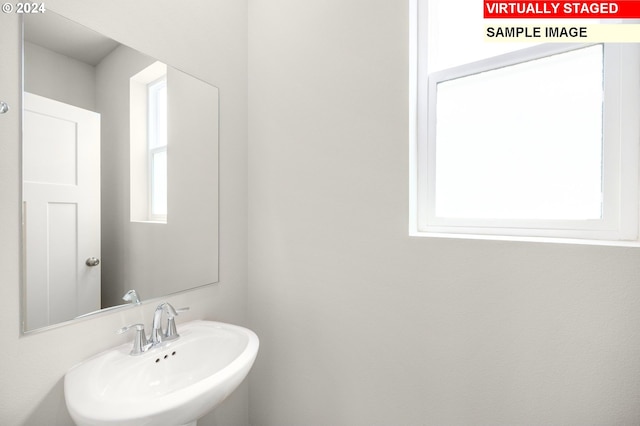 bathroom with sink and a wealth of natural light