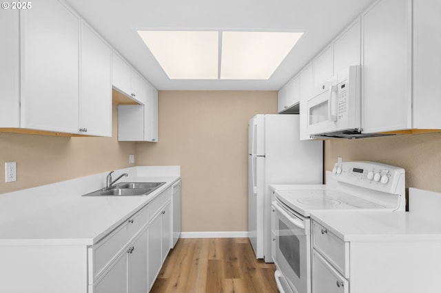 9480 SW 146th Ter Unit Q1, Beaverton, OR 97007 - kitchen with white appliances, a sink, light wood-type flooring, and white cabinets