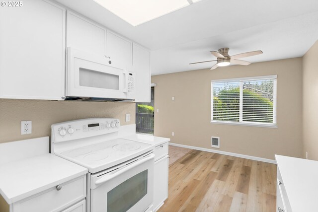 9480 SW 146th Ter Unit Q1, Beaverton, OR 97007 - kitchen with white appliances, light brown cabinets, and a sink