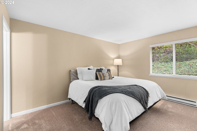 bedroom featuring carpet flooring and baseboard heating