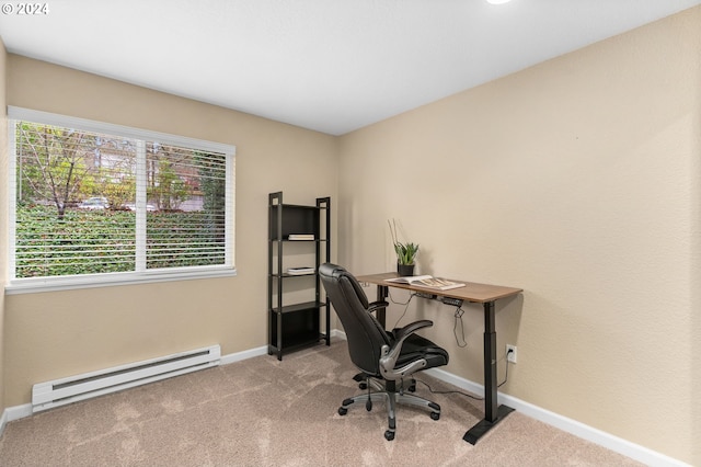 carpeted home office featuring a baseboard heating unit