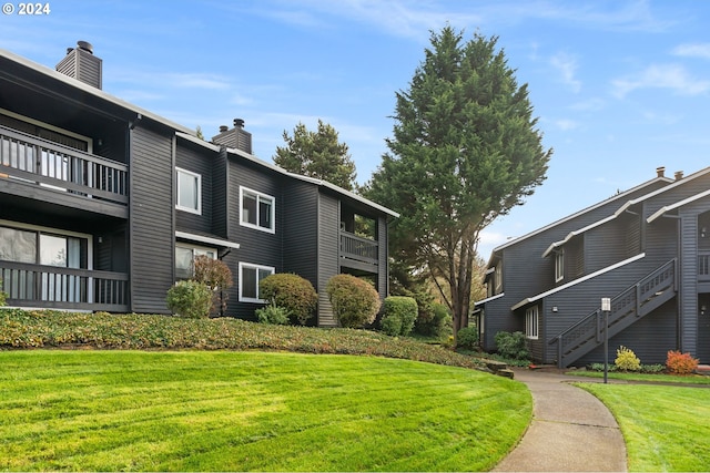 view of property's community with a yard