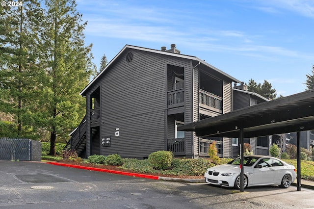 view of home's exterior with a carport