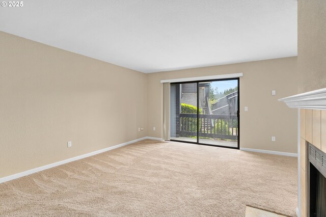 9480 SW 146th Ter Unit Q1, Beaverton, OR 97007 - unfurnished living room with carpet and baseboards