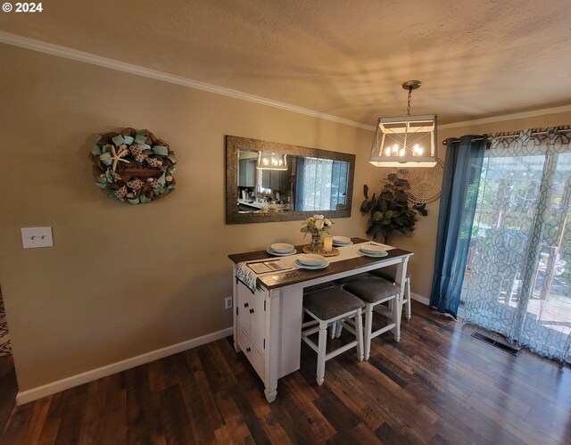 dining room featuring ornamental molding, dark hardwood / wood-style floors, and plenty of natural light