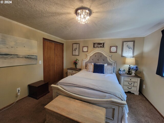 bedroom featuring dark carpet, a closet, ornamental molding, and a textured ceiling