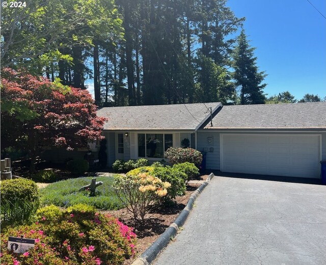 single story home featuring a garage