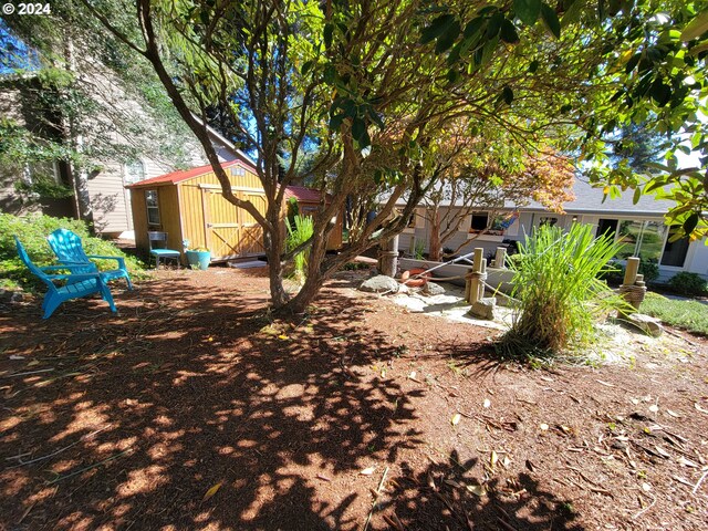 view of property exterior featuring a storage shed