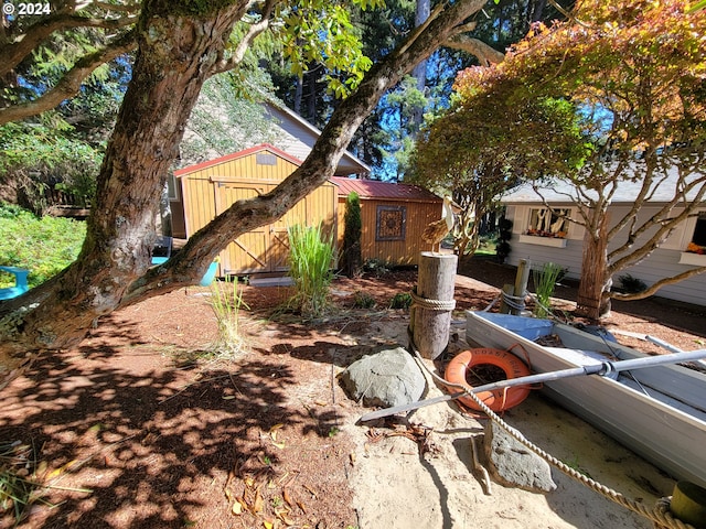 view of side of property featuring a shed