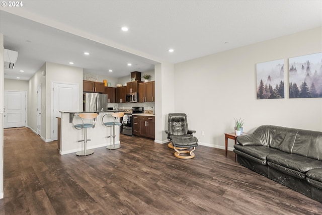 12948 SE 155th Ave, Happy Valley, OR 97086 - living room featuring dark wood-style floors, baseboards, and recessed lighting