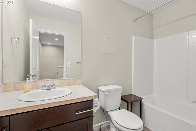 full bathroom with bathing tub / shower combination, vanity, and toilet