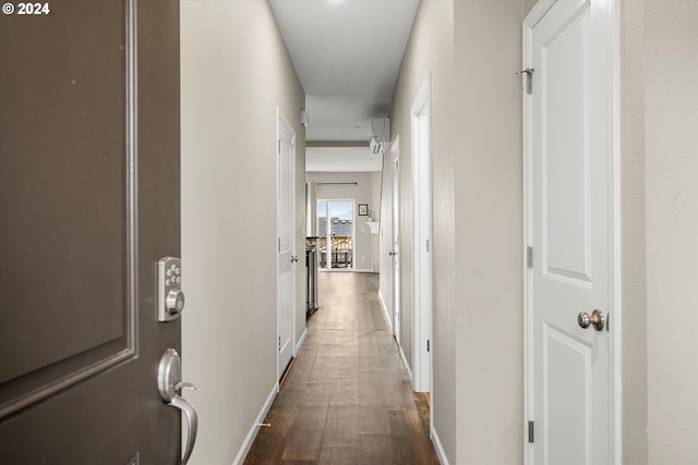 hallway featuring dark hardwood / wood-style floors